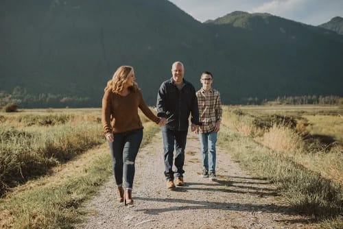 Family walking with mountain backdrop