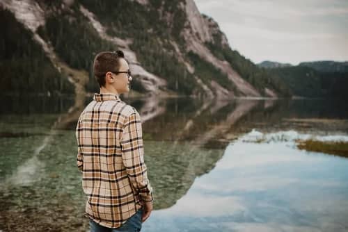 Teenage boy in front of mountain