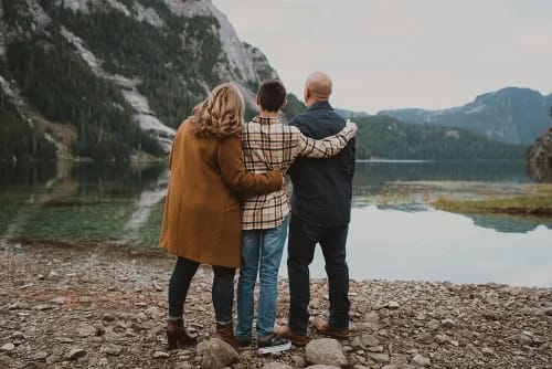 Failing hugging looking at a lake