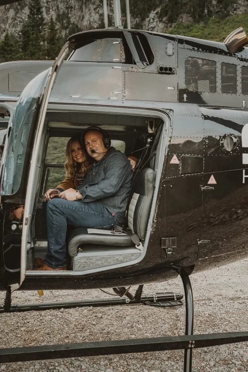 Couple in helicopter smiling