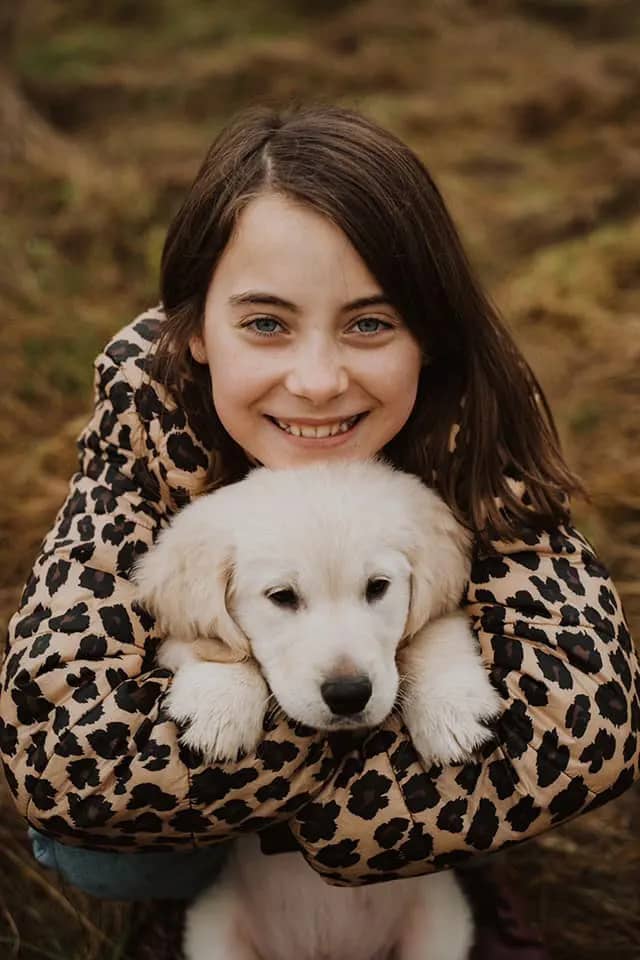 Young girl with her puppy